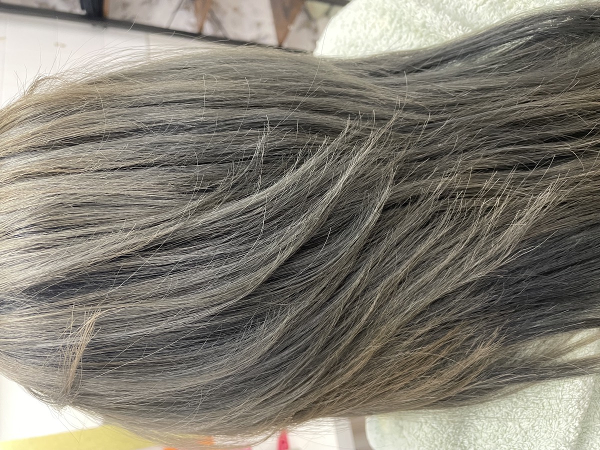 Long hair with silver and grey tones blended through darker lengths